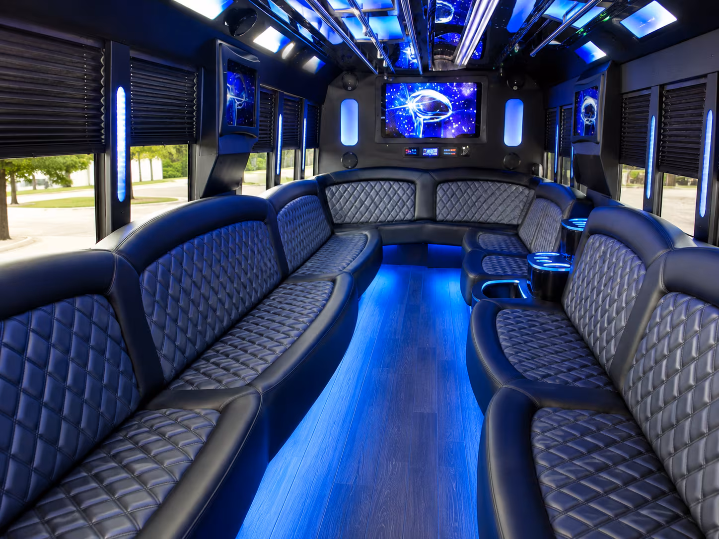 Friends laughing during a party bus celebration in New Orleans