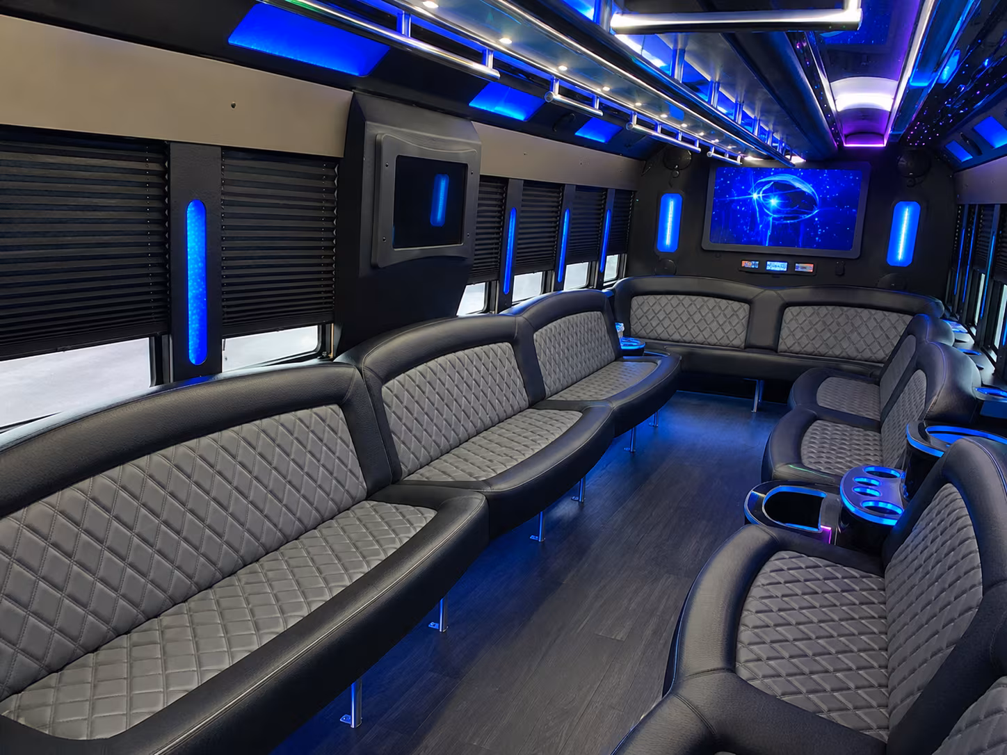 Wedding guests seated inside a party bus serving New Orleans