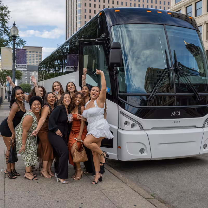 Passengers loading luggage while boarding an New Orleans group shuttle