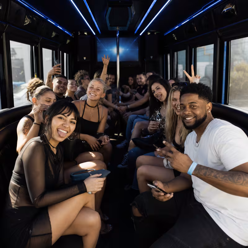 Passengers loading luggage while boarding an New Orleans group shuttle