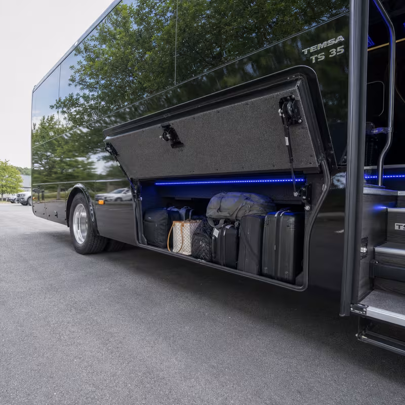 Party bus interior with wraparound leather seating and LED lighting in New Orleans