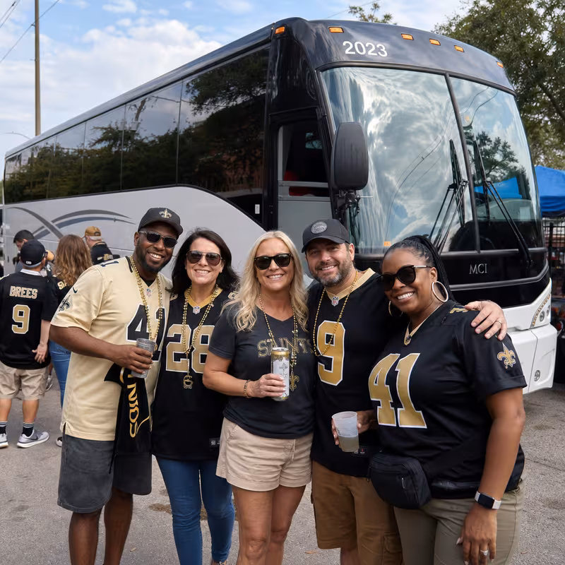 Passengers loading luggage while boarding an New Orleans group shuttle