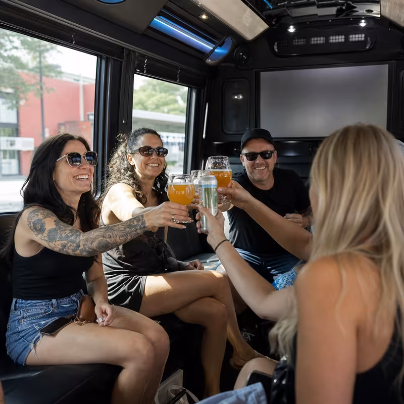 Group boarding a white charter bus for Winery & Brewery Tour Transportation transportation in New Orleans